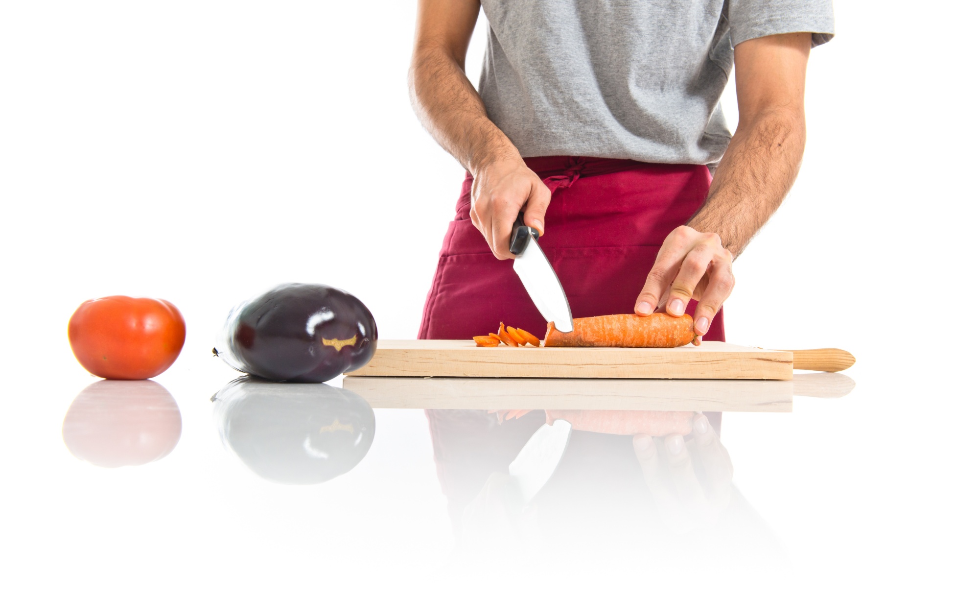Chef che insegna una tecnica di taglio